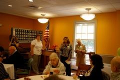 Woman Giving Speech to Large Group